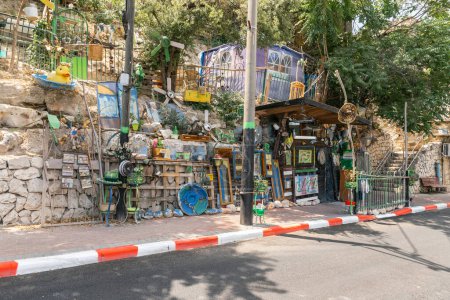 Photo for Safed, Israel, July 01, 2023 : Street stall with drinks and small sweets, decoratively decorated with old household items in the Safed city old part of in northern Israel - Royalty Free Image