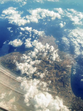 View from window of the airplane flying over the Cyprus from the Tel Aviv city in Israel towards the Mediterranean Sea and Europe