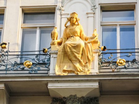 Photo for Prague, Czech Republic, July 27, 2010 : Decorative stone female statue on the railing of a balcony in the old part of the Prague in Czech Republic - Royalty Free Image