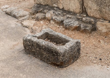 Photo for Remains of a stone bath at the excavation of the Canaanite Fortifications of the Megiddo site near Yokneam city in the northern Israel - Royalty Free Image