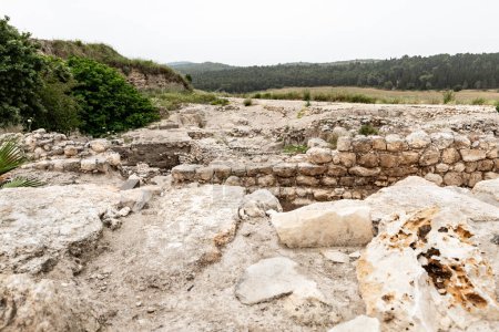 Photo for Remains of Canaanite Palace walls at the excavation of the Canaanite Fortifications of the Megiddo site near Yokneam city in the northern Israel - Royalty Free Image