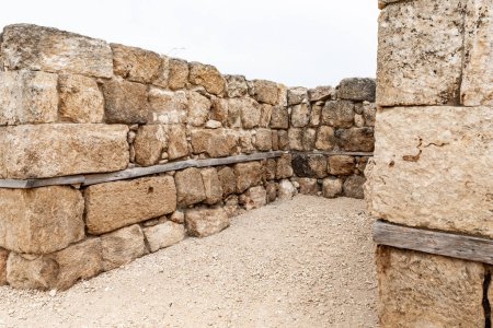 Photo for Remains of Canaanite Palace inner walls at the excavation of the Canaanite Fortifications of the Megiddo site near Yokneam city in the northern Israel - Royalty Free Image