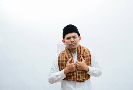 Photo for Asian muslim man showing sad expression - Royalty Free Image