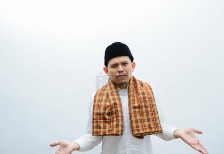Photo for Asian muslim man showing sad expression - Royalty Free Image