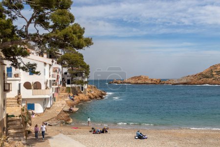 Photo for Begur, Spain - Apr 16, 2023: People on Sa Tuna beach, one of the most populars bay in Costa Brava, Spain - Royalty Free Image
