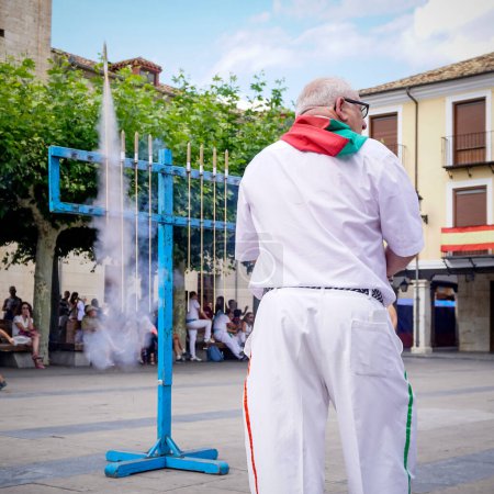 Photo for Knight preparing to shoot fireworks during the town festivities - Royalty Free Image