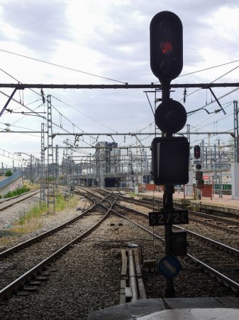 Railway tracks with a light signal in the foreground