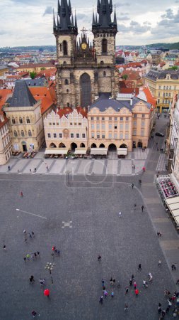 Main square of Prague, Czechia. Old buildings, view from the clock tower. Small people. Cloudy day. Nice place to visit. Historic part, Europe.