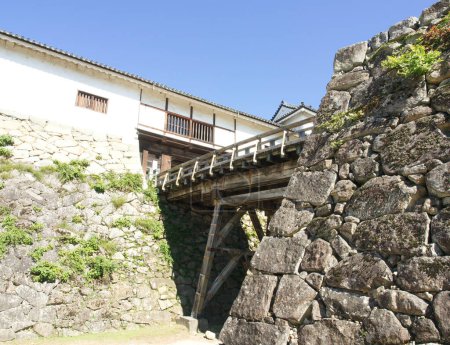 Photo for The formidable and strong castle bridge of Hikone Castle with blue sky at Shiga Prefecture Japan. - Royalty Free Image