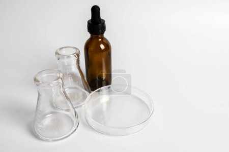 Clear bottles and dishes are used in scientific and medical experiments.