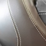 An interior view of a leather automobile seat. macro picture. ,natural suede leather background with an abstract texture