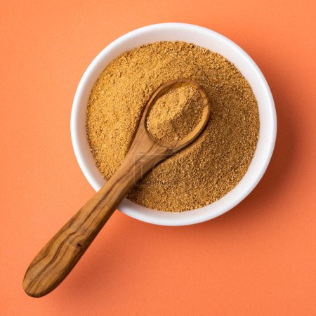 Photo for Lepidium meyenii - Maca powder in the bowl and spoon - Royalty Free Image