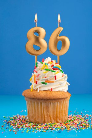 Birthday cake with candle number 86 - Blue background