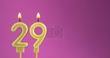 Candle number 29 in purple background - birthday card