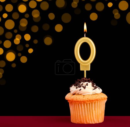 Photo for Birthday candle with cupcake - Number 0 on black background with out of focus lights - Royalty Free Image