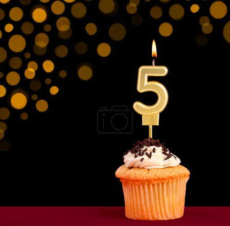 Photo for Number 5 birthday candle - Cupcake on black background with out of focus lights - Royalty Free Image