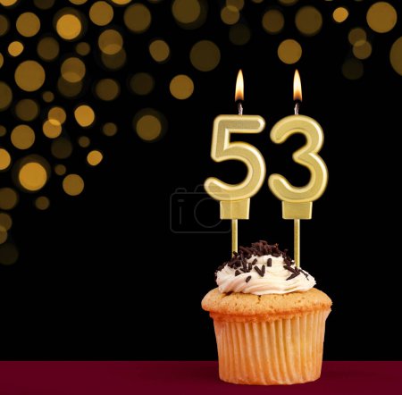 Photo for Number 53 birthday candle - Cupcake on black background with out of focus lights - Royalty Free Image