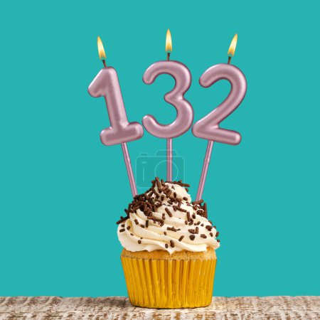 Photo for Birthday card with number 132 candle on aquamarine background - Royalty Free Image