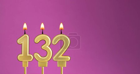 Photo for Candle number 132 in purple background - birthday card - Royalty Free Image