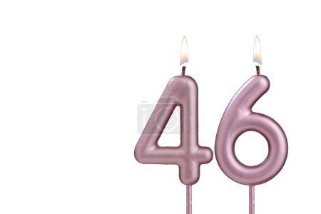 Lit birthday candle - Candle number 46 on white background