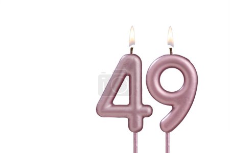 Candle number 49 - Lit birthday candle on white background