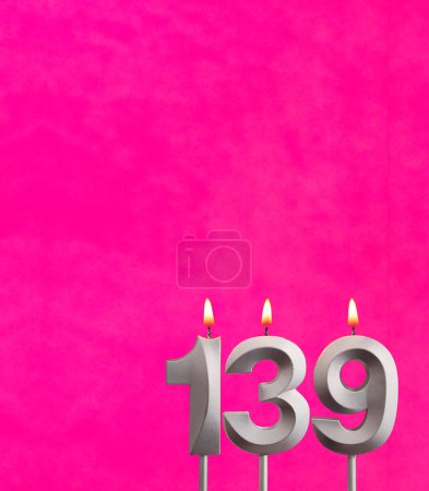 Candle number 139 - Birthday celebration on fuchsia background