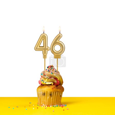 Birthday candle number 46 - Cupcake on white background