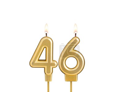 Golden number 46 birthday candle on white background