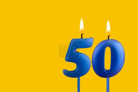 Blue candle number 50 - Birthday on yellow background