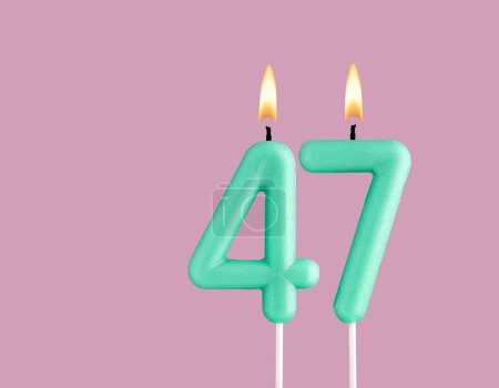 Birthday card with green number 47 candle - Pastel pink background