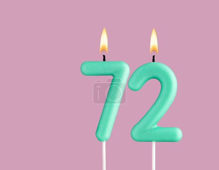 Green candle number 72 - Birthday card on pastel pink background