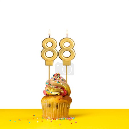 Birthday candle number 88 - Cupcake on white background