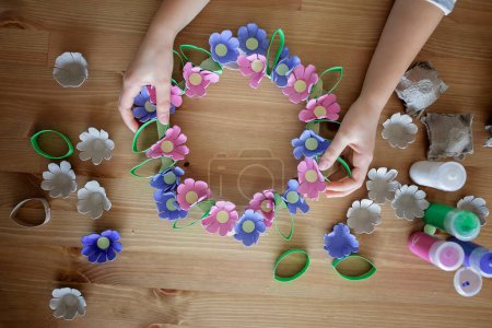 Photo for DIY project with kids, an egg carton is transformed into Easter flower wreath. Creativity and sustainability that come with a Zero Waste lifestyle. Reduce, reuse, and recycle - Royalty Free Image
