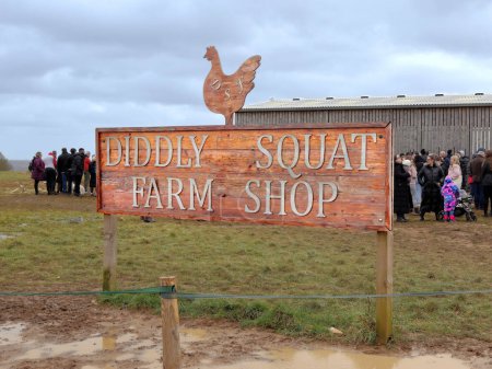 Photo for Chipping Norton, UK - March 12, 2023: Crowds of visitors queuing at  Diddly Squat Farm Shop opened in 2020 by Jeremy Clarkson. - Royalty Free Image