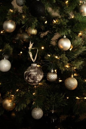 Photo for Christmas tree with decorations ball and ultrasound picture in it . High quality photo - Royalty Free Image