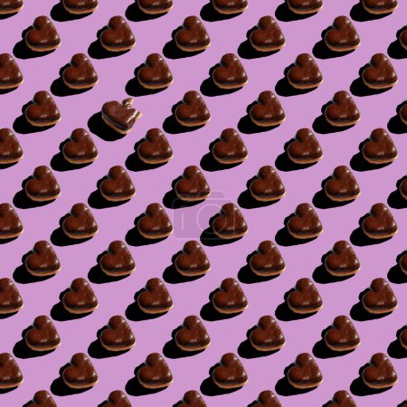 Foto de Seamless pattern of chocolate heart shaped donuts on purple background. High quality photo - Imagen libre de derechos