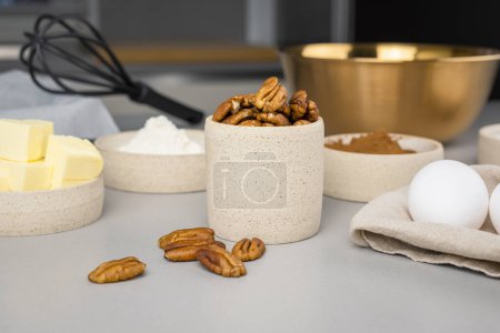 Photo for Close-up of the ingredients for brownie on a grey surface in the modern kitchen. Culinary blog. - Royalty Free Image