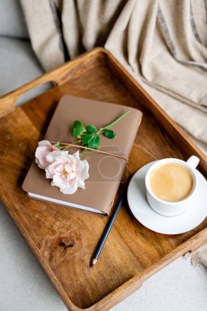 Photo for Notepad, pencil and a cup of coffee on a tray. - Royalty Free Image