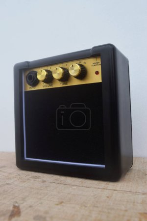 Closeup photo of a mini guitar amplifier that has good sound and is used by several musicians in Indonesia