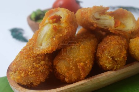 Close up photo of Indonesian food which is often called "Risoles" is a snack with a layer of eggs and flour which has vegetables in it, Isolated white