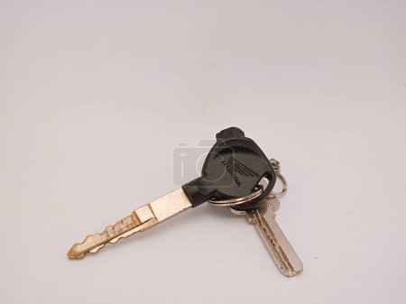 Photo for Kediri, Indonesian - January 16 2024 : Honda motorbike key and key chain on white background - Royalty Free Image