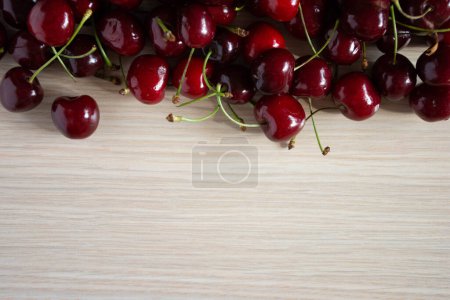 Photo for Fresh red cherries on wooden background - Royalty Free Image