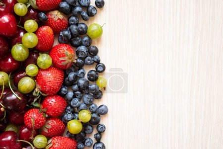 Photo for Berries variety, berries background with cherry fruits, strawberries, gooseberry and blueberries. Healthy eating lifestyle concept. - Royalty Free Image