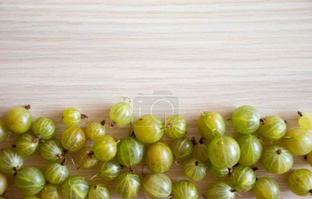 Photo for Gooseberry fruits arrangement, healthy fruits on wooden background - Royalty Free Image