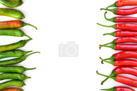 Photo for Hot peppers border isolated on white background, top view, in line. Cayenne pepper, Anaheim Pepper, long red peppers isolated. Horizontal row of hot spicy peppers. - Royalty Free Image