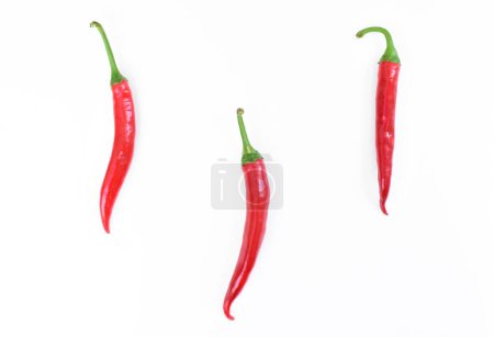 Photo for Hot peppers isolated on white background, top view. Cayenne pepper, Anaheim Pepper, long red peppers isolated. High quality photo - Royalty Free Image