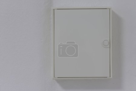 Photo for White fuse box closed on the wall - Royalty Free Image