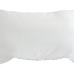White pillow in hotel or resort room is isolated on white background with clipping path.