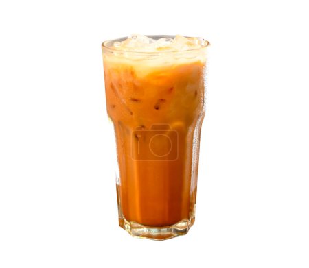 Iced orange Thai condensed milk Tea in transparent glass is isolated on white background with clipping path.	