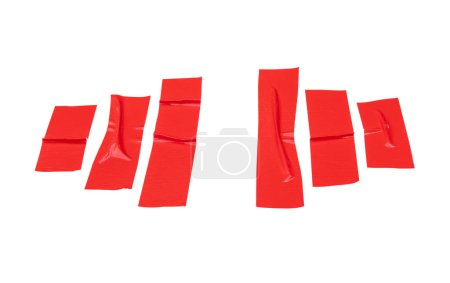 Top view set of wrinkled red adhesive vinyl tape or cloth tape in stripes is isolated on white background with clipping path.